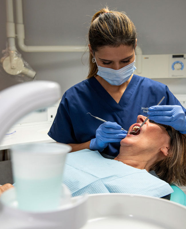 Dentist treating patient with endodontics
